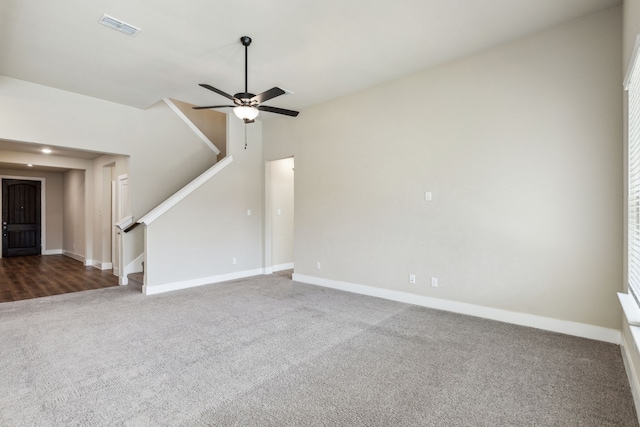 5408 Fairdale Dr, Denton, TX 76207 - unfurnished living room with stairway, carpet floors, baseboards, and a ceiling fan