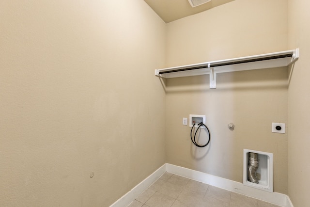 5408 Fairdale Dr, Denton, TX 76207 - washroom with gas dryer hookup, washer hookup, electric dryer hookup, baseboards, and light tile patterned flooring
