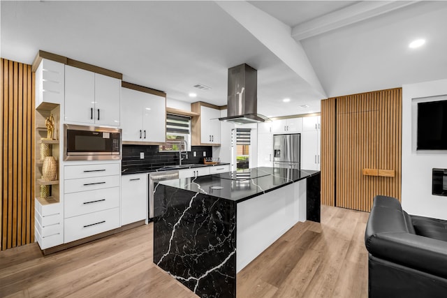 4122 Azalea Ln, Garland, TX 75043 - kitchen featuring appliances with stainless steel finishes, island range hood, tasteful backsplash, light wood-style floors, and beam ceiling