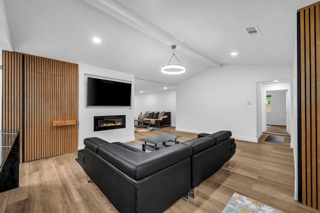 4122 Azalea Ln, Garland, TX 75043 - living area featuring wood finished floors, baseboards, a glass covered fireplace, and recessed lighting