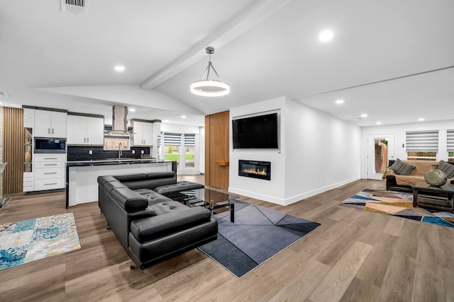 4122 Azalea Ln, Garland, TX 75043 - living room with baseboards, wood finished floors, recessed lighting, and a glass covered fireplace