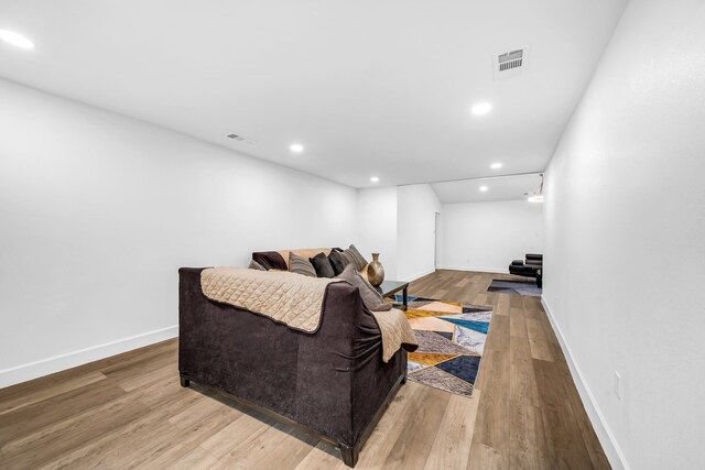4122 Azalea Ln, Garland, TX 75043 - living room featuring wood finished floors, baseboards, and recessed lighting