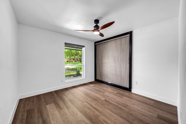 4122 Azalea Ln, Garland, TX 75043 - unfurnished room featuring ceiling fan, wood finished floors, and baseboards