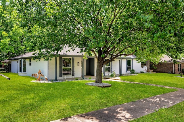 4122 Azalea Ln, Garland, TX 75043 - view of front of property featuring a front yard and brick siding