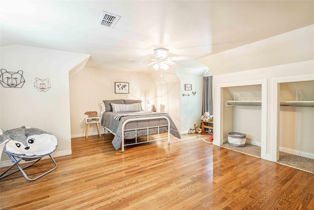 3418 S 11th St, Abilene, TX 79605 - bedroom with two closets, wood finished floors, ceiling fan, vaulted ceiling, and baseboards