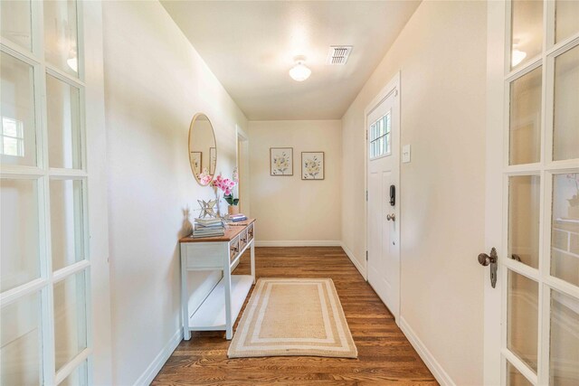 3418 S 11th St, Abilene, TX 79605 - entryway with wood finished floors, french doors, and baseboards