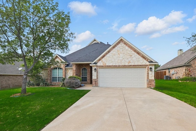 706 Dove Rdg, Sanger, TX 76266 - view of front of home with brick siding, a front lawn, and central air condition unit