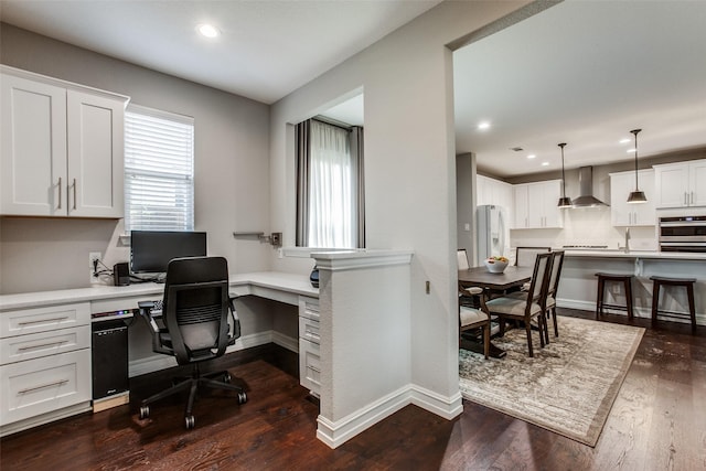 414 Kirkland Rd, Garland, TX 75044 - home office featuring dark wood finished floors, recessed lighting, baseboards, built in study area, and a sink
