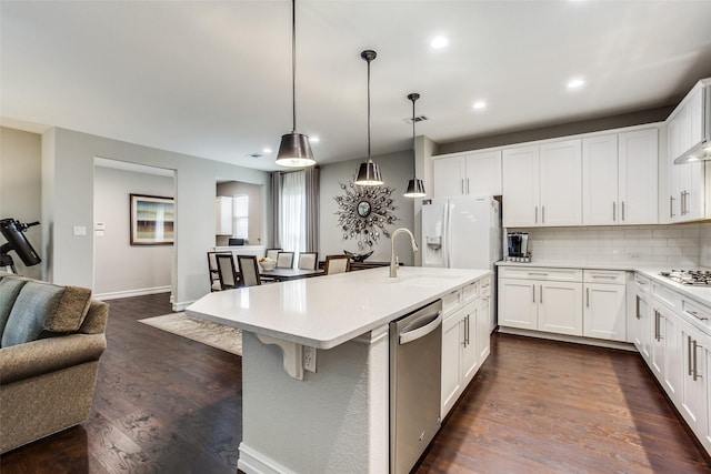 414 Kirkland Rd, Garland, TX 75044 - kitchen featuring dishwasher, a sink, white refrigerator with ice dispenser, backsplash, and open floor plan