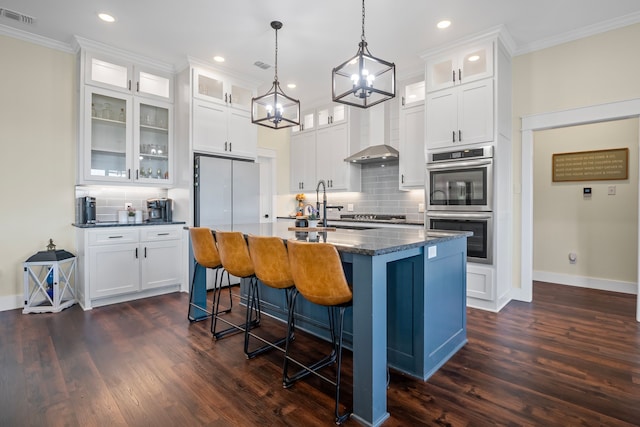 174 Rs County Road 3160, Emory, TX 75440 - kitchen with double oven, ornamental molding, decorative backsplash, dark wood-style floors, and a kitchen island with sink