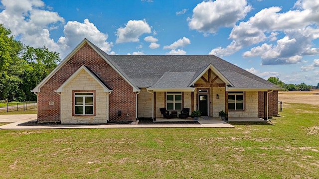 174 Rs County Road 3160, Emory, TX 75440 - view of front of property with stone siding, roof with shingles, and covered porch