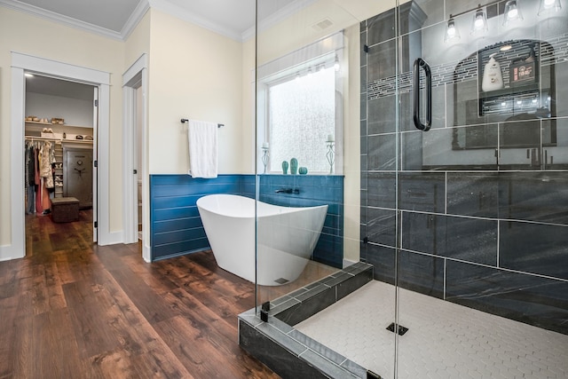 174 Rs County Road 3160, Emory, TX 75440 - bathroom with a stall shower, a freestanding tub, crown molding, wood finished floors, and a walk in closet