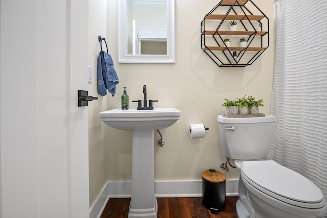174 Rs County Road 3160, Emory, TX 75440 - bathroom with wood finished floors, baseboards, and toilet