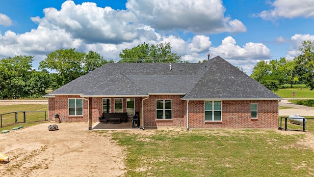 174 Rs County Road 3160, Emory, TX 75440 - back of property featuring brick siding, a shingled roof, a patio, and a gate