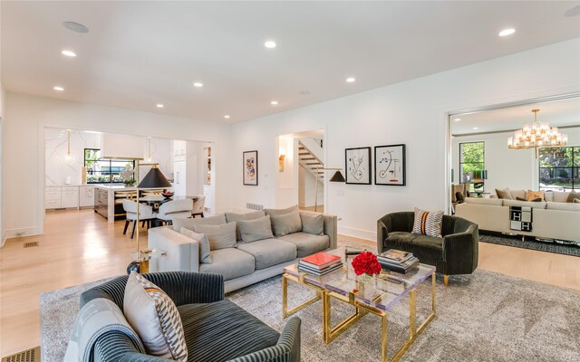 3713 Greenbrier Dr, University Park, TX 75225 - living room with a chandelier, light wood-type flooring, stairway, recessed lighting, and baseboards