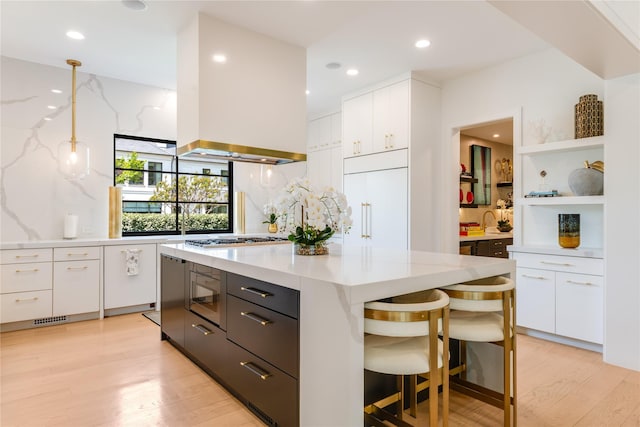 3713 Greenbrier Dr, University Park, TX 75225 - kitchen with white cabinetry, light wood-style floors, decorative backsplash, built in appliances, and recessed lighting