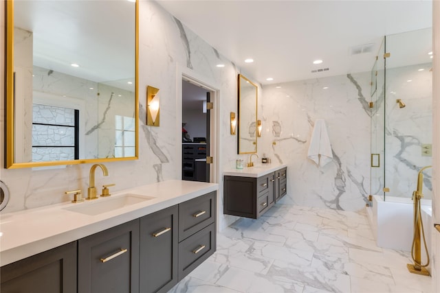 3713 Greenbrier Dr, University Park, TX 75225 - bathroom featuring a marble finish shower, marble tiled floors, stone wall, two vanities, and recessed lighting