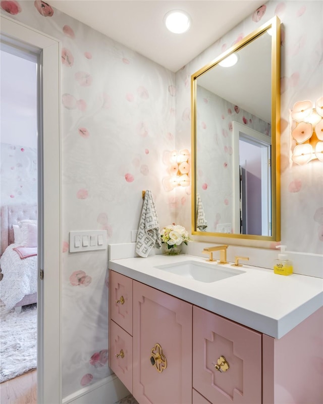 3713 Greenbrier Dr, University Park, TX 75225 - bathroom with wallpapered walls, vanity, and connected bathroom