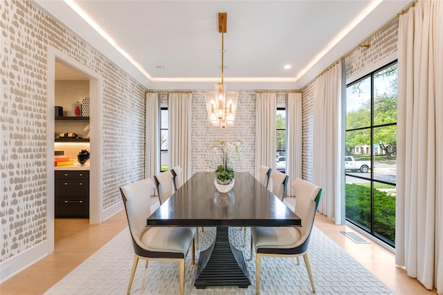3713 Greenbrier Dr, University Park, TX 75225 - dining room with a chandelier, light wood-style floors, and brick wall