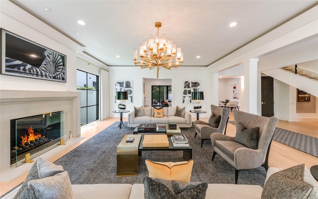 3713 Greenbrier Dr, University Park, TX 75225 - living area with recessed lighting, a chandelier, a premium fireplace, ornate columns, and wood finished floors