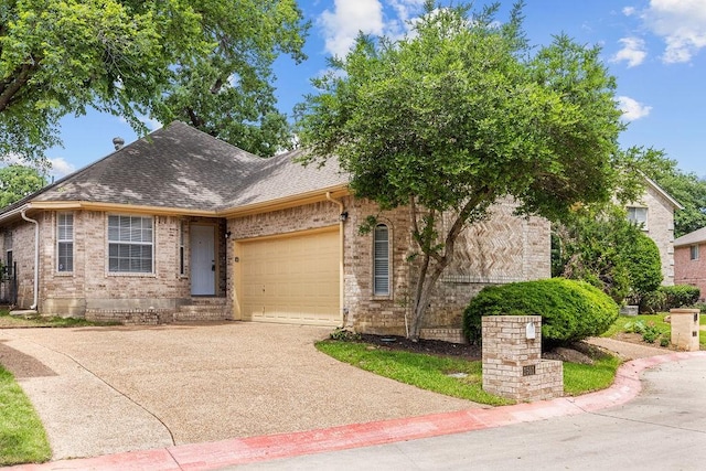 1501 Milla Ct, Euless, TX 76039 - view of front facade featuring a garage, driveway, brick siding, and roof with shingles