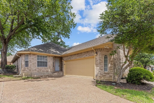 1501 Milla Ct, Euless, TX 76039 - single story home featuring concrete driveway, an attached garage, brick siding, and roof with shingles