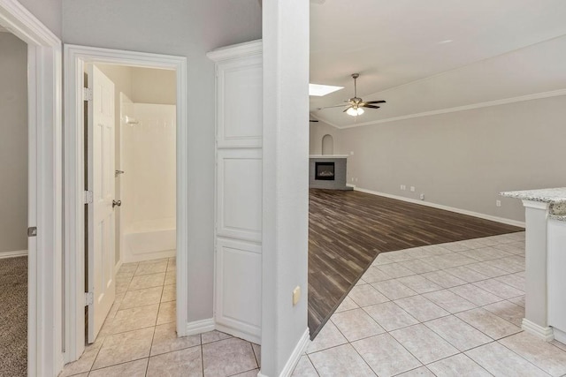 1501 Milla Ct, Euless, TX 76039 - hallway with lofted ceiling, light tile patterned flooring, baseboards, and ornamental molding