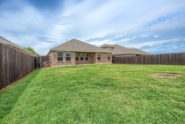 1316 Renoir Dr, Little Elm, TX 75068 - back of property featuring brick siding and roof with shingles