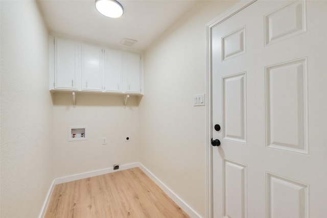 3011 Sunnybrook Ln, Arlington, TX 76014 - laundry area with cabinet space, hookup for an electric dryer, washer hookup, light wood finished floors, and baseboards