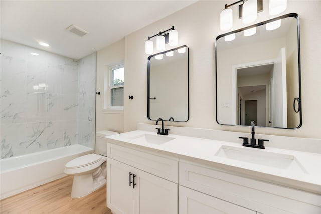 3011 Sunnybrook Ln, Arlington, TX 76014 - full bath with toilet, wood finished floors, double vanity, and shower / bathtub combination