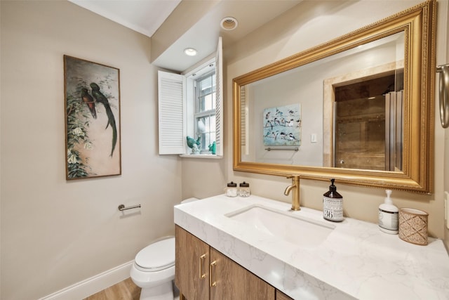 7008 Joyce Way, Dallas, TX 75225 - bathroom with vanity, toilet, baseboards, a shower, and wood finished floors