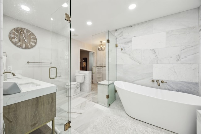 7008 Joyce Way, Dallas, TX 75225 - full bath with marble finish floors, double vanity, a soaking tub, recessed lighting, and a stall shower