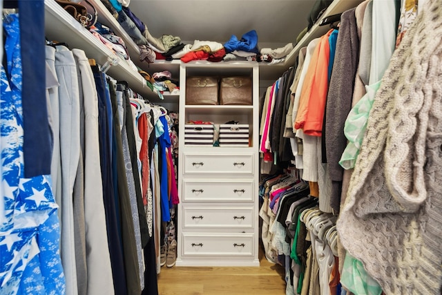 7008 Joyce Way, Dallas, TX 75225 - walk in closet featuring light wood-style floors