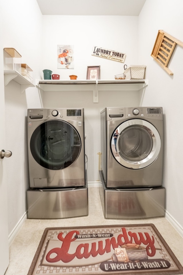 513 Lake Cove Dr, Little Elm, TX 75068 - laundry area with washer and dryer, baseboards, and tile patterned floors