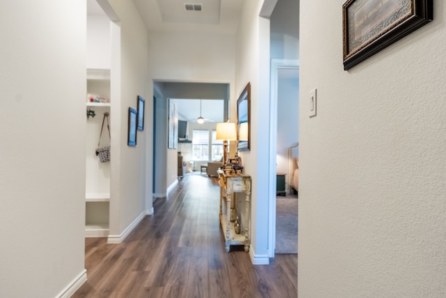 513 Lake Cove Dr, Little Elm, TX 75068 - hallway with dark wood-type flooring, baseboards, and a textured wall