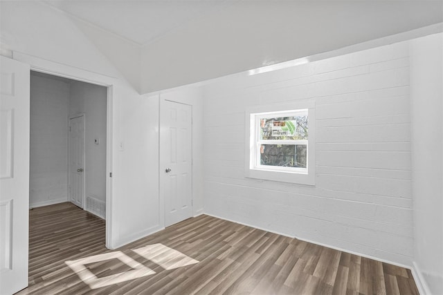 401 E Buffalo St, Forney, TX 75126 - unfurnished bedroom with wood finished floors, a closet, and baseboards