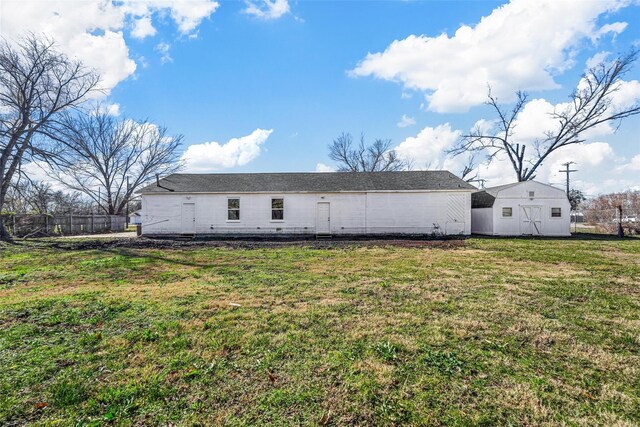 401 E Buffalo St, Forney, TX 75126 - back of house featuring a storage shed and an outbuilding
