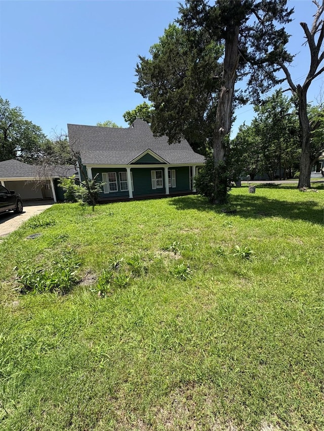 401 S Bois D Arc St, Forney, TX 75126 - view of front of house with a front lawn, an attached carport, driveway, and roof with shingles