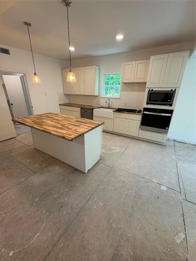 401 S Bois D Arc St, Forney, TX 75126 - kitchen featuring stainless steel oven, a sink, wooden counters, black dishwasher, and built in microwave