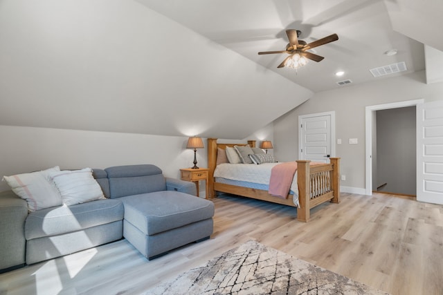 bedroom featuring light wood-style flooring, vaulted ceiling, ceiling fan, and baseboards