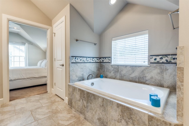 4100 Emerson Ave Unit 8, University Park, TX 75205 - ensuite bathroom with lofted ceiling and a bath