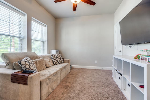 4100 Emerson Ave Unit 8, University Park, TX 75205 - living area featuring a ceiling fan, light carpet, and baseboards