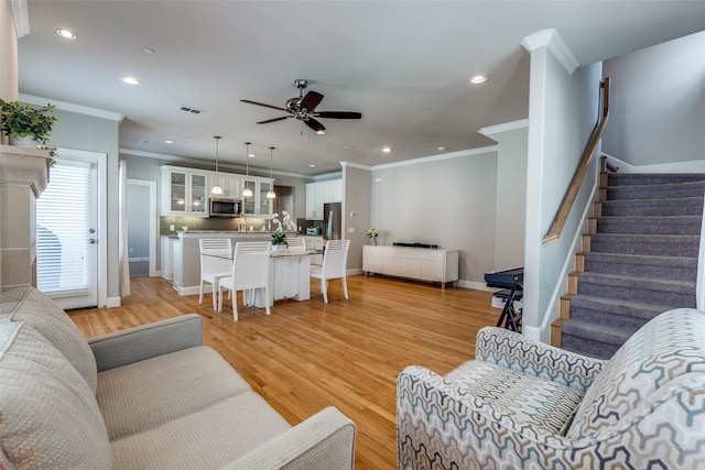 4100 Emerson Ave Unit 8, University Park, TX 75205 - living room with ornamental molding, recessed lighting, ceiling fan, stairway, and light wood finished floors