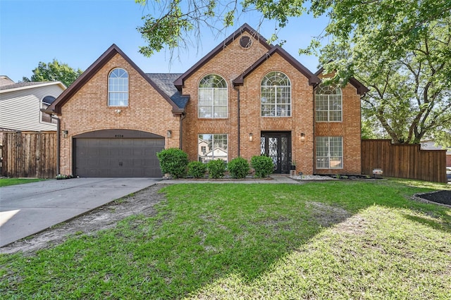 4524 Rosedale Dr, Grand Prairie, TX 75052 - traditional-style house featuring driveway, brick siding, and an attached garage