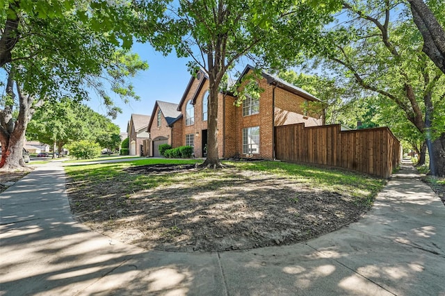 4524 Rosedale Dr, Grand Prairie, TX 75052 - view of front of home featuring brick siding and fence