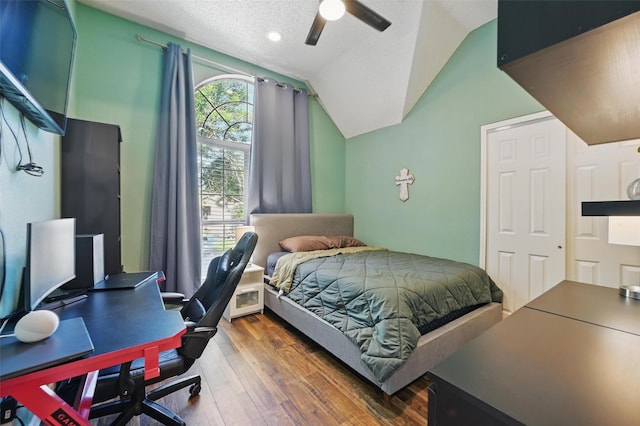 4524 Rosedale Dr, Grand Prairie, TX 75052 - bedroom featuring wood finished floors, vaulted ceiling, a desk, ceiling fan, and a textured ceiling