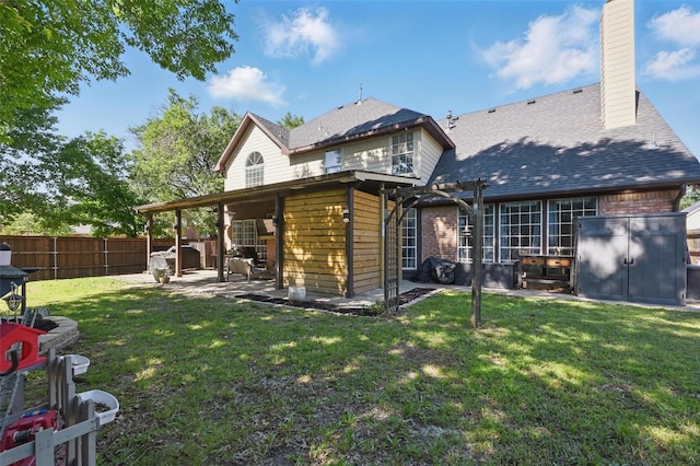 4524 Rosedale Dr, Grand Prairie, TX 75052 - back of house featuring a patio, a shed, a chimney, an outbuilding, and brick siding