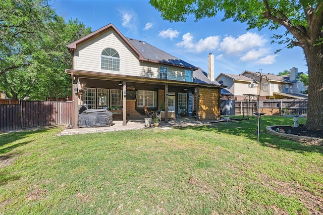 4524 Rosedale Dr, Grand Prairie, TX 75052 - back of house with a patio area and a chimney
