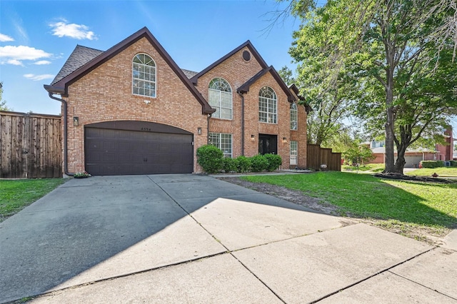 4524 Rosedale Dr, Grand Prairie, TX 75052 - view of front facade with brick siding, a garage, and concrete driveway
