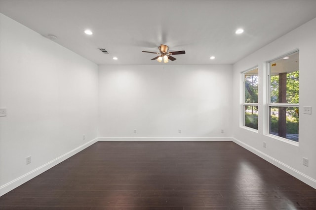 710 E 3rd Ave, Corsicana, TX 75110 - spare room featuring a ceiling fan, recessed lighting, dark wood finished floors, baseboards, and a smoke detector